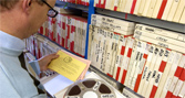 Librarian checks the 7,000 tape archive in the archive vault