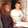 Billie Sule and Matthew Baker holding a computer keyboard.