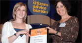 receives her prize from a trustee of Citizens Advice
