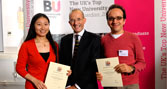 Vice-Chancellor Professor Paul Curran with two prize winners