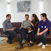 Liam Burns (far left) talking to BU students