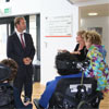 Tobias Ellwood MP (left) chats with  Carrie Hodges, senior lecturer in the Media School (right) and young people from Victoria Education Centre who have taken part in the Seen But Seldom Heard project