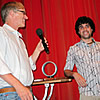 BU Computer Animation student Simone Giampaulo (right) receives the audience award at the One Minute Film and Video Festival in Switzerland from Michael Berger, one of the festival’s founders.
