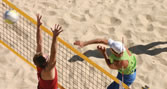An image of people playing Beach Volleyball