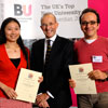 Vice-Chancellor Professor Paul Curran with two award winners