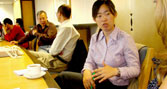 Ms Zhu Li talks with BU staff