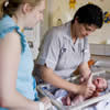 An image of a Midwife with a baby