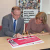 Vice-Chancellor Professor John Vinney joining Sue Forber of Time to Change in signing the Time to Change Organisational Pledge on behalf of Bournemouth University