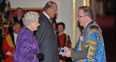 Vice-Chancellor, Professor John Vinney receiving the award from Her Majesty the Queen and The Duke of Edinburgh
