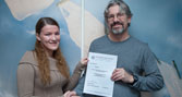 Sarah Wall receives her certificate from programme coordinator Dr Jim Pope