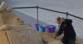 Jamie Wardley creating the NeSSa sand sculpture on campus
