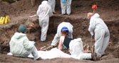 BU students excavate one of the simulated mass graves