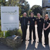 Hotel manager and student staff outside Hinton Firs