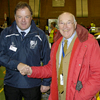 Dr Bruce Grant-Braham shaking hands with Murray Walker